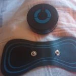 Nooro Whole Body Massager on bed